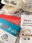 ป้ายพิมพ์ - ผลิตป้ายติดเสื้อ - ปริ๊นซ์ ครีเอชั่น